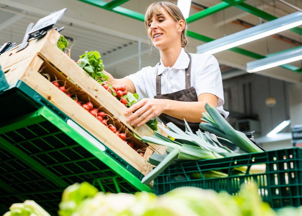 Happy grocery store employee